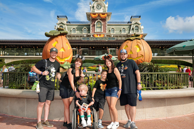 Golias Family in Front of Pumpkins